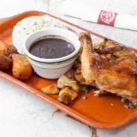 Pollo Havana 1957 · A Cuban family recipe of roasted chicken topped with Cuban gravy. Served with white rice, bl...