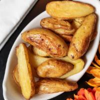 Fingerling Potatoes · Roasted garlic, thyme, gluten friendly.