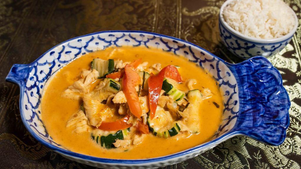 Panang Curry · Panang curry paste with coconut milk, green bean, bell pepper; basil and onion. Spicy.
