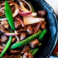 Ye-Beg Tibs · Tender pieces of lamb cooked with onions, garlic, rosemary, and jalapeno peppers