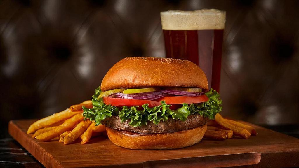 Classic Steak Burger* · Green leaf lettuce, tomatoes, red onion & dill pickles on a butter toasted brioche bun