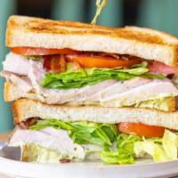 Miami Sandwich · Ham, turkey, cheese, bacon, lettuce, and tomatoes.