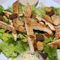 Caesar Salad · Romaine lettuce, dressed, with parmesan cheese and croutons.