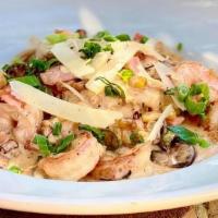 Shrimp & Grits · blackened shrimp, local cajun andouille sausage, peppers, red onion, corn, cream sauce