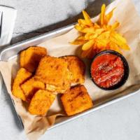 Fried Ravioli · Breaded and fried ravioli served with a marinara dipping sauce.