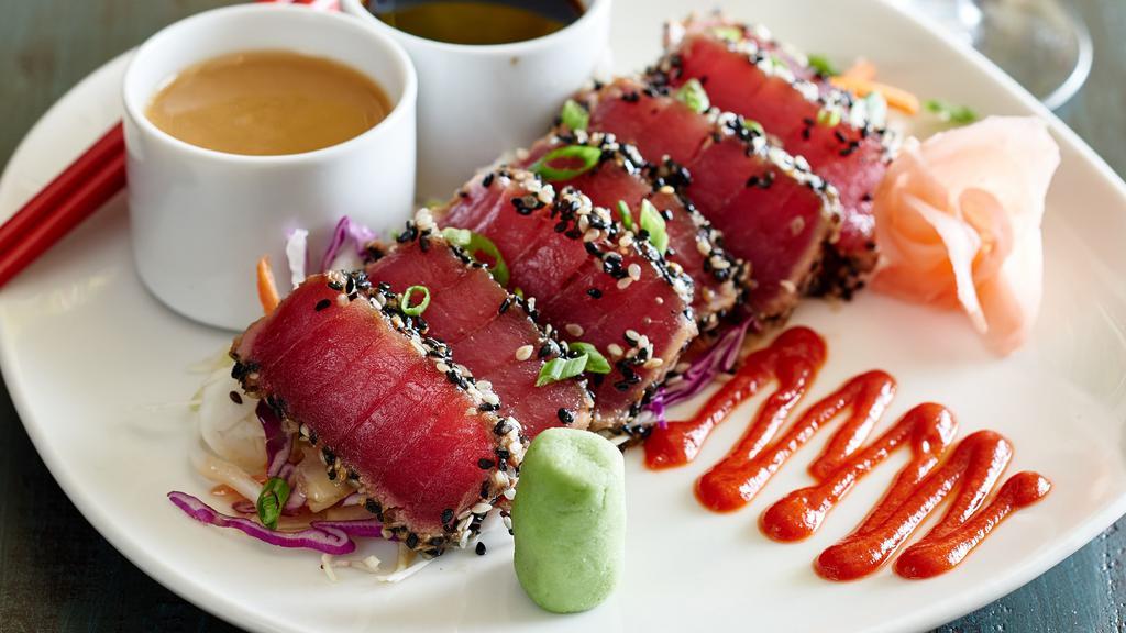 Ahi Tuna Sashimi · sesame seared, with wasabi, soy, sesame ginger sauce.                                                                                                                  
                                                                                                                                                                 
Consuming raw or undercooked meats, poultry, seafood, shellfish, or eggs may increase your risk of food-borne illness.