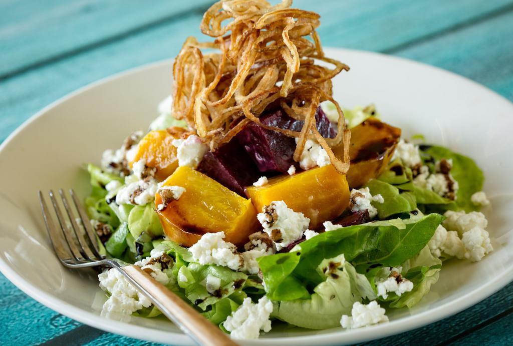 Beet Salad · bibb lettuce, roasted red and golden beets, Tavern vinaigrette, goat cheese, balsamic, reduction, crispy shallots.