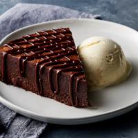 Godiva® Chocolate Torte · Rich and very moist French cake, French vanilla ice cream, hot fudge.