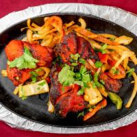 Tandoori Chicken (Full) · Sizzling full chicken, spiced in a combination of herbs, cooked to perfection in the tandoor.