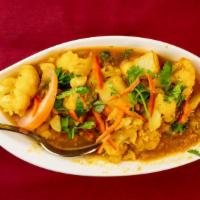 Aloo Gobi · Garden fresh florets of cauliflower and potato cooked along with fresh herbs and spices.