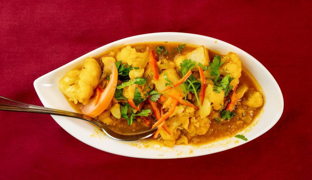 Aloo Gobi · Garden fresh florets of cauliflower and potato cooked along with fresh herbs and spices.