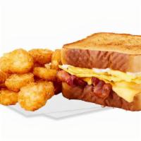 Big Breakfast Sandwich Combo · Your choice  of bacon or sausage with eggs, cheese and mayo between two pieces of Texas toas...