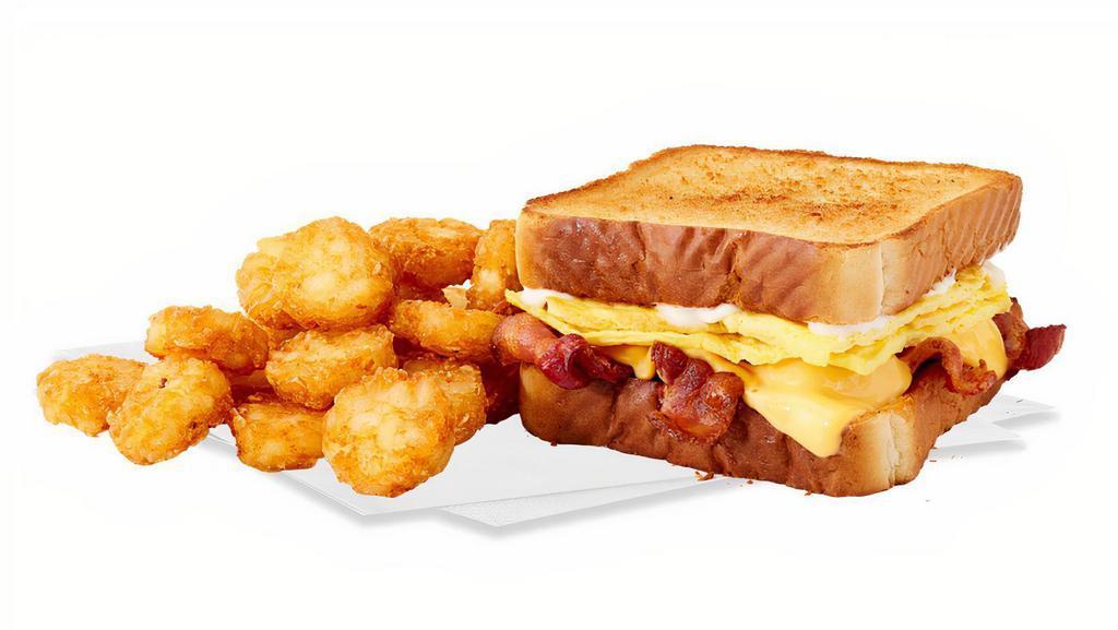 Big Breakfast Sandwich Combo · Your choice  of bacon or sausage with eggs, cheese and mayo between two pieces of Texas toast. Served with hash browns and a drink.
