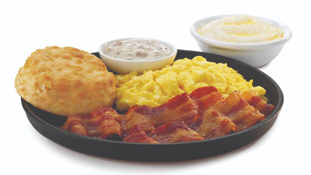 Breakfast Special · Two scrambled eggs, home-style hearty grits, and a freshly baked made-from-scratch buttermilk biscuit with gravy. Served with your choice of two slices of crispy bacon or sausage
