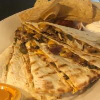 Quesadilla · Warm, grilled tortilla filled with your choice of grilled veggies, chicken or beef and red o...