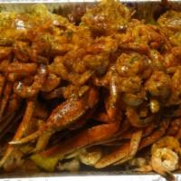 Garlic Party Tray · 10 Snow crab clusters, 10 corn, 10 slices of potatoes, 60 shrimp with garlic seasoning and g...