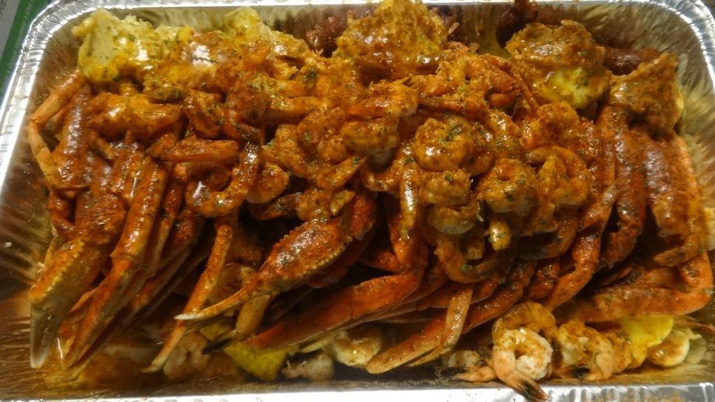 Garlic Party Tray · 10 Snow crab clusters, 10 corn, 10 slices of potatoes, 60 shrimp with garlic seasoning and garlic butter.