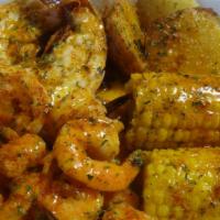 Garlic Lobster N Shrimp · One lobster tail, 15 shrimp, two corn, two potatoes with our garlic butter and garlic season...
