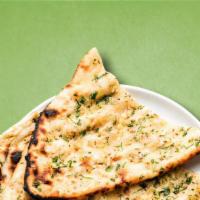 Master Garlic Naan · A whole wheat bread baked in tandoor grill and topped with garlic.