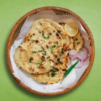 Simply Naan · Leavened white bread baked in tandoor oven.