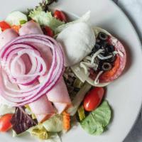 Carmine Salad · Artisan salad blend, tomatoes, red onion, cucumber, salami, pepperoni, fresh mozzarella, Gia...