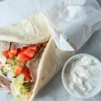 The Gyro · Authentic gyro meat, tzatziki sauce, on fresh-baked pita, topped with lettuce tomato and oni...