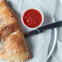 Chicago Baked Calzone · Same as the jersey but we bake it, da??? After baking, we do coat the creation with garlic b...