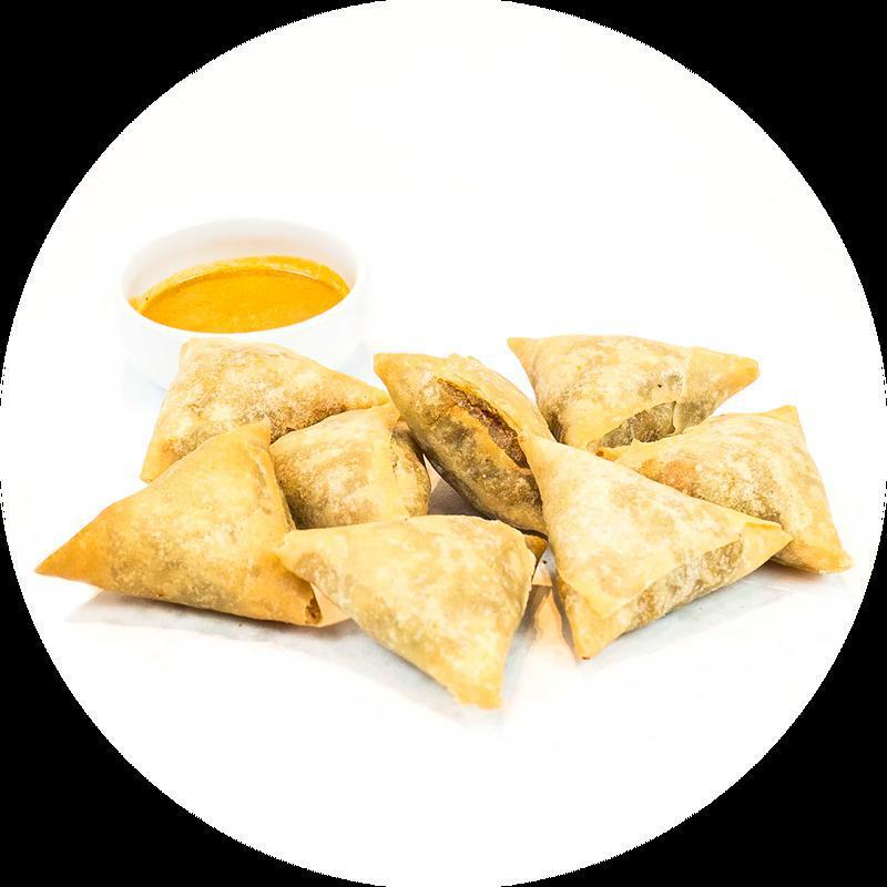 Fried Samosa (8) *Vegetarian · (8 pieces) Curry potatoes, chick peas, onions, lentils, wonton skin served with curry sauce. (Vegetarian)