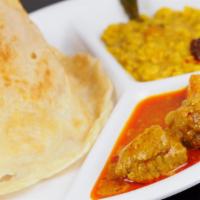 Curry Chicken Roti Plate · Soft and fluffy on the inside and flaky on the outside, roti is a type of flatbread original...