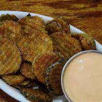 Fried Pickles · Sliced kosher dill pickles tossed in our house-made seasoned fry flour served with our house...