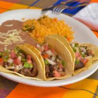 Tacos Al Pastor (3) · Served w/ cilantro, rice & refried beans.