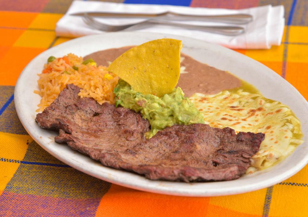 Carne Tampiqueña · Flank Steak grilled with cheese enchilada. Served with a side of guacamole, rice & refried beans.