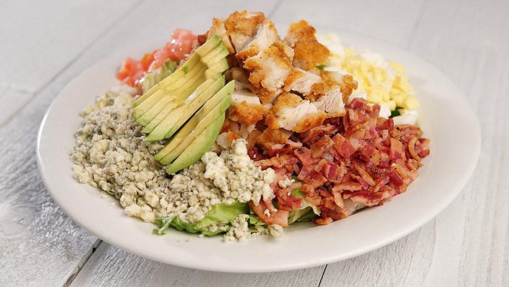 Cobb Salad W/Chicken · Southern Fried Chicken on top of Romaine & Iceberg Mix, Avocado, Tomato, Chopped Bacon, Egg & Blue Cheese Crumbles, Served with your choice of Dressing.