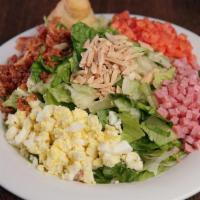 Small Tavern Salad · Iceberg and Romaine Mix, Tomatoes, Eggs, Ham, Bacon, and Almonds.