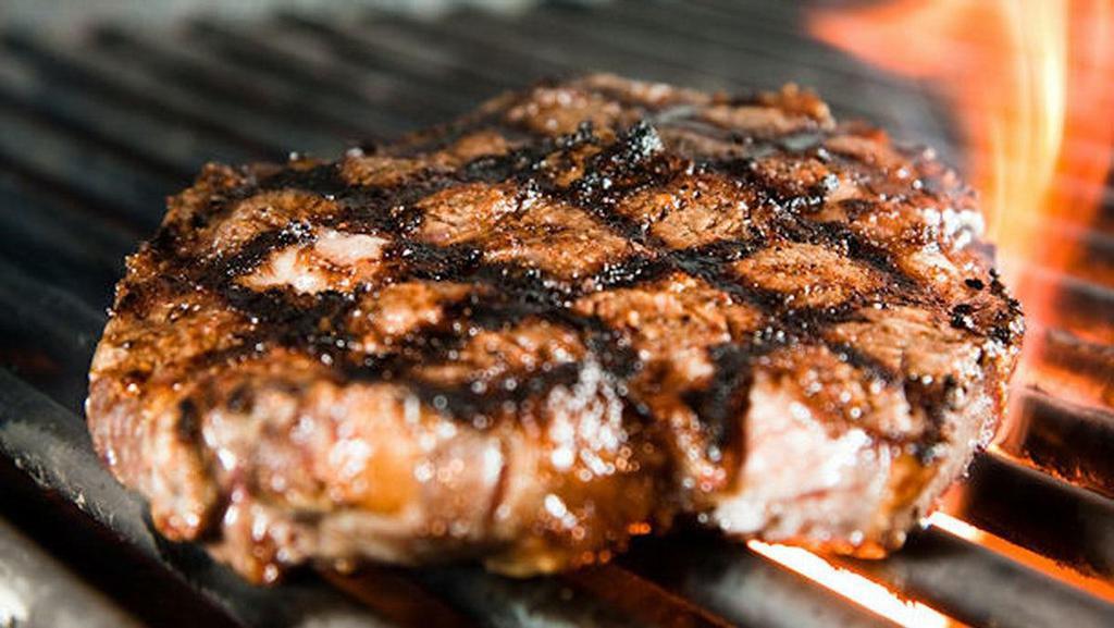 *Ribeye · Chargrilled to perfection, served with tavern greens & one side