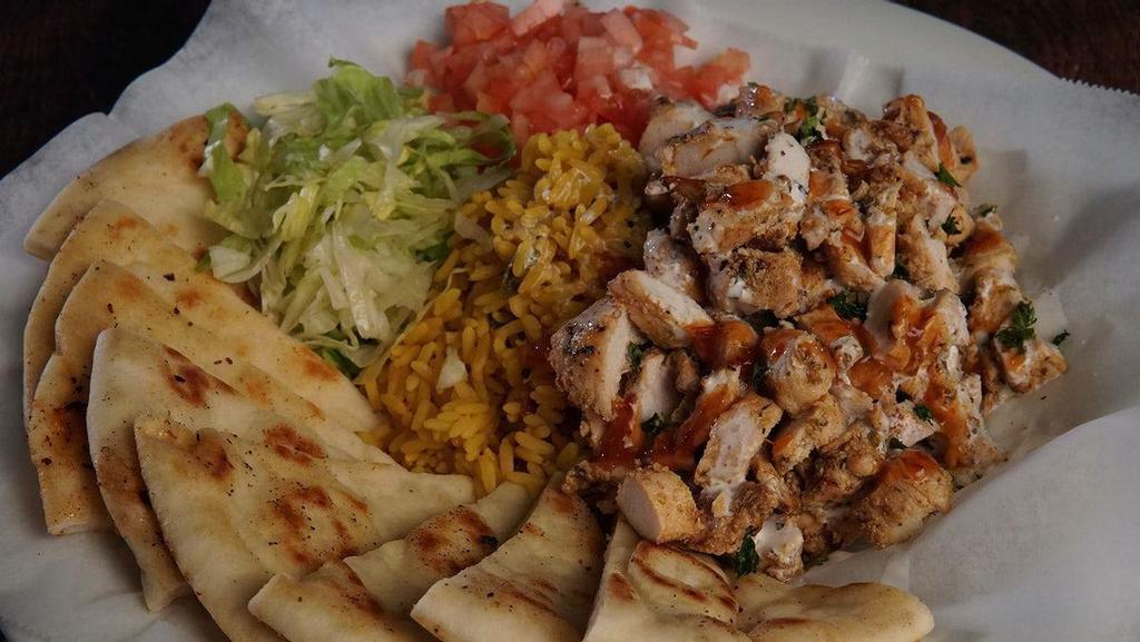 Food Truck Chicken & Rice · straight from the streets of NYC, marinated chopped chicken, yellow rice, white sauce, sambal sauce, shredded lettuce, tomato & warm pita bread