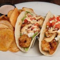 Spicy Shrimp Tacos · Two Tacos filled with Blackened Shrimp, Shredded Lettuce, Queso Fresco and Tomato. Topped wi...