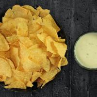 Chips & Queso Tailgate Package · 1 Gallon of Tortilla Chips and a Large Bowl of our Signature Queso Dip