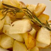 Vegan Roasted Potatoes · Roasted potatoes with fresh rosemary.