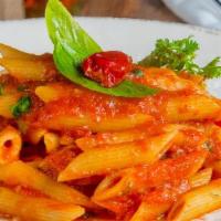 Vegan Arrabbiata Penne · Penne pasta with spicy tomato sauce, garlic, and dried red chili pepper.