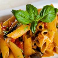 Vegan Penne Alla  Siciliana · Penne pasta with eggplant, vegan mozzarella cheese, garlic, and tomato sauce.
