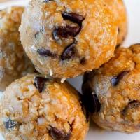 Peanut Butter & Chocolate Chip Bites · Peanut butter, chocolate chips, whole grain oats, whey protein, coconut shavings, and honey.
