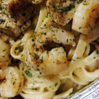 Cilantro  Shrimp Pasta · Cilantro Herb marinated  shrimp on top of a bed creamy Fettuccine alfredo noodles.served wit...