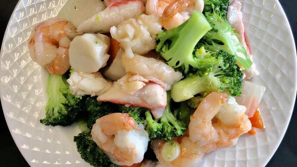 Seafood Delight · Lobster meat, jumbo shrimp, scallops, and crabmeat with assorted Chinese vegetable in white sauce. With white rice.