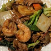 4 Seasons · Jumbo shrimp, beef, chicken, and roast pork with mixed veg in brown sauce. With white rice.