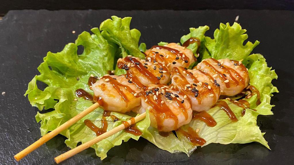 Yaki Ebi · Broiled shrimp on skewers with teriyaki glaze.