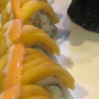Sunset Boulevard Roll · Shrimp, avocado, crab meat inside. Topped with mango and fish eggs and spicy sauce.