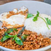 Kraprao Gai Kai Dao · Thal street-food style minced chicken stir fry with rich, spicy thai basil topped with fried...
