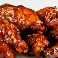 8 Classic Bone-In Wings · 8 classic bone-in chicken wings fried to perfection. Served with celery and carrots sticks w...
