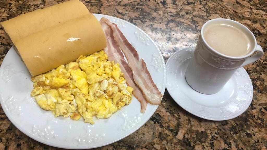 Combo #2 · Huevos revueltos, tostada y café con leche con jamón o bacon. / Scrambled eggs, Cuban toast with milk and coffee with a choice of ham or bacon